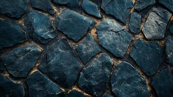 Textured stone background displaying a pattern of dark blue rocks with beige filling, ideal for artistic and abstract designs. photo