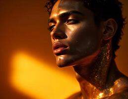 Fashion portrait of a beautiful african american woman with golden make-up. Golden Man Portrait photo