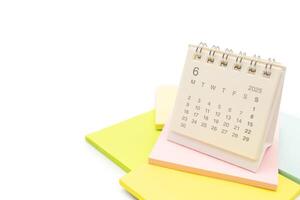 Desk Calendar for JUNE 2025 background. Calendar concept with 2025 JUN calendar on Sticky note. isolated on white background. photo