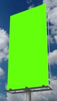 Vartical blank green billboard or large advertising display. Chroma key, time lapse, green screen, template, mock up and copy space concept promotion product portrait video