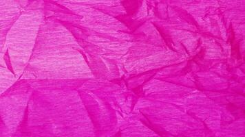 Crumpled paper stop motion animation, Textured pink paper background. The concept of sketch pad, design, retro style, wrinkle, frayed, blank video