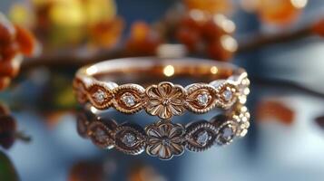A rose gold ring with a flower design photo