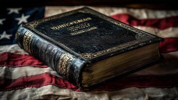 A black Bible is on top of a red and white American flag photo