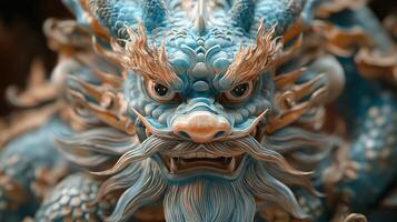 A blue dragon statue with a long beard photo
