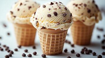 Three ice cream cones with chocolate chips photo