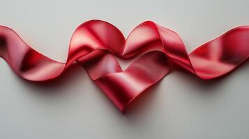 A red heart shaped ribbon on a white background photo