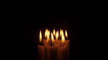 Burning candles on a black background is a symbol of sadness and sorrow video