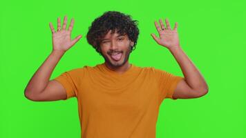 Comical funny indian man making playful silly facial expressions, fooling around, showing tongue video