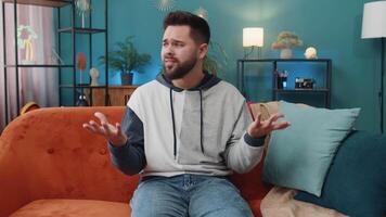 Caucasian man guy asking why, what reason of failure demonstrating disbelief irritation by troubles video