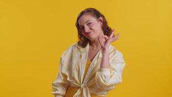 Woman looking approvingly, showing ok approve feedback gesture like sign positive something good video