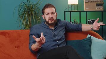 Confused lebanese man feeling embarrassed about ambiguous question having doubts, no idea, no answer video