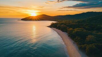 Aerial beautiful shot of a seashore with hills on the background at sunset photo