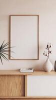 Mock up of a blank frame on a wooden shelf with a plant and vase photo