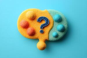 Abstract Puzzle Sponge with Question Mark on Blue Background for Problem Solving Concepts photo