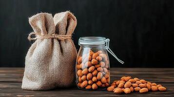 Almonds in a Glass Jar and Burlap Sack Rustic Food Still Life photo