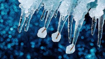Stunning Close Up of Icicles Hanging Against a Sparkling Blue BackgroundWinter Ice Crystals Nature photo