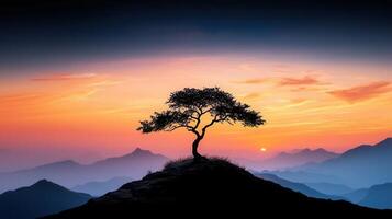 Serene Sunset Landscape Lone Tree Silhouette on Mountain Peak at Sunrise Breathtaking View of Misty Mountains photo