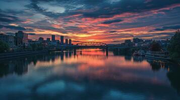A stunning sunset over a river with city silhouettes and colorful reflections photo