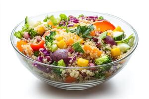 A vibrant quinoa salad filled with colorful vegetables and herbs. photo