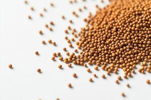 A close-up of scattered small brown seeds on a white surface. photo