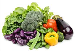 A colorful assortment of fresh vegetables including broccoli, peppers, and eggplant photo