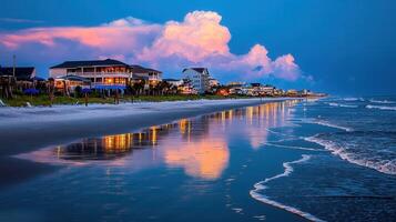 Stunning Coastal Houses at Sunset Beachfront Property with Ocean Waves and Clouds photo