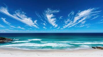 Stunning Beach Scene with Vibrant Turquoise Ocean and Cirrus Clouds A Perfect Summer Vacation Paradise photo