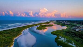Serene Coastal Sunset Scenic Aerial View of Ocean Beach Inlet and Houses photo