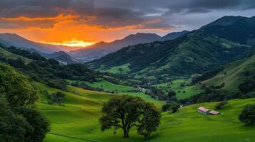 Serene Sunset over Rolling Green Hills and Mountains Dramatic Landscape photo