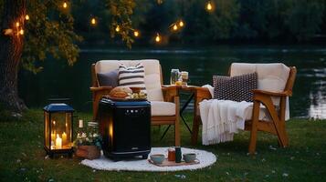 Relaxing Evening by the Lake Outdoor Cozy Scene with String Lights and Warm Drinks photo