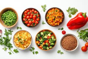 A vibrant assortment of fresh vegetables and pasta arranged in bowls for healthy meal preparation photo