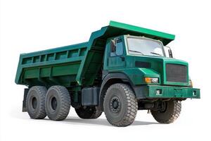 A green dump truck designed for transporting heavy materials. photo