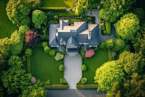 Aerial view of a beautifully landscaped home surrounded by lush greenery photo