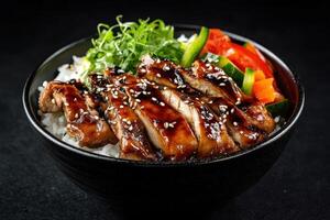 A delicious bowl of grilled chicken with rice and fresh vegetables, drizzled with sauce photo