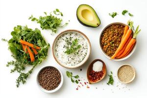 A vibrant arrangement of ingredients for a healthy meal, featuring rice, vegetables, and spices photo