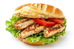 A delicious grilled chicken sandwich with lettuce, tomato, and a soft bun. photo