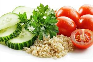 Fresh vegetables and quinoa arranged for a healthy meal photo