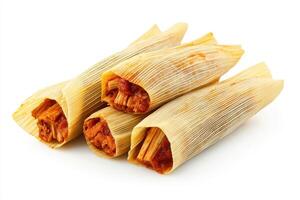 A close-up of tamales wrapped in corn husks, showcasing traditional Mexican cuisine photo