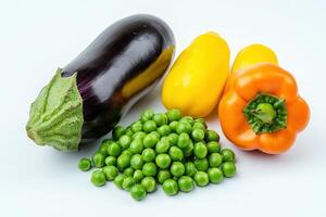 A colorful assortment of vegetables including eggplant, bell peppers, and green peas photo