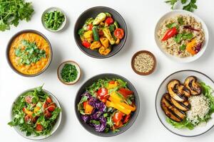 A colorful arrangement of healthy dishes featuring salads, grains, and grilled vegetables. photo
