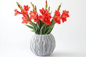 A decorative vase filled with vibrant red gladiolus flowers. photo