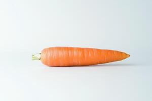 A fresh carrot displayed on a plain background, showcasing its vibrant orange color photo