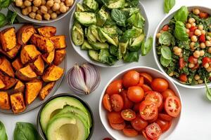 A vibrant assortment of fresh vegetables and legumes arranged in bowls for a healthy meal photo