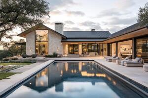 Modern house with a pool, surrounded by nature at sunset photo