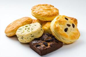 A variety of baked goods including biscuits and brownies arranged on a white background photo
