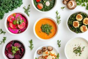 A colorful assortment of healthy dishes featuring soups and salads photo