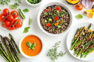A vibrant assortment of healthy dishes featuring quinoa, vegetables, and sauces photo