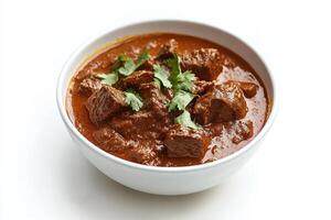 A bowl of savory beef curry garnished with fresh cilantro. photo