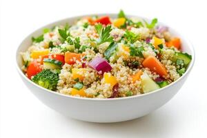 A colorful quinoa salad filled with various fresh vegetables. photo