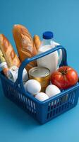 A basket filled with food items on a blue background photo